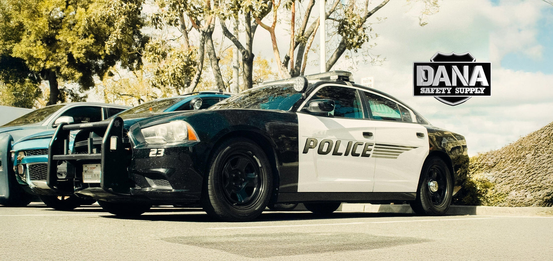 Police vehicle parked with the Dana Safety Supply logo in the corner